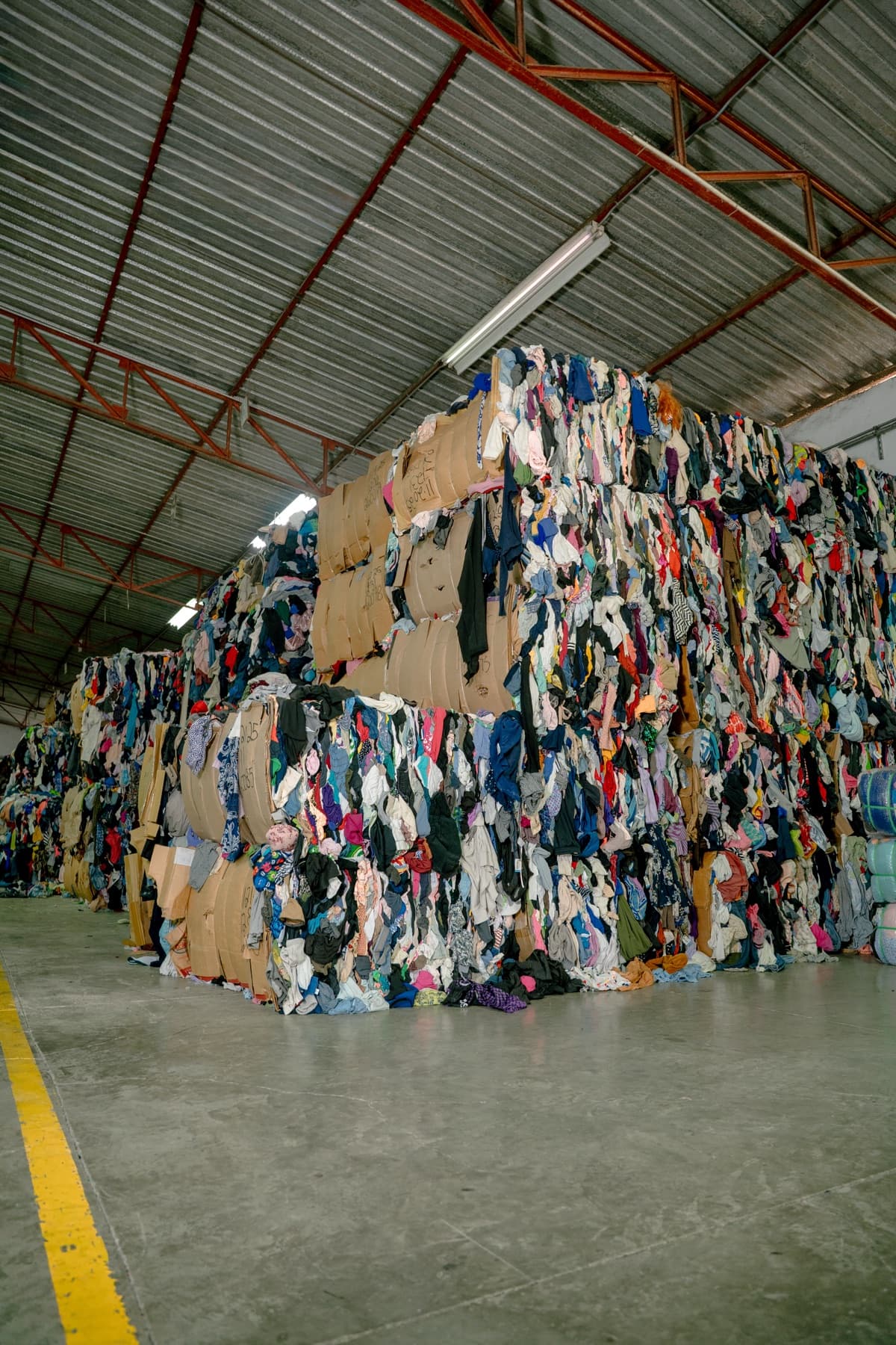 Compressed mixed rag bales stacked in the warehouse